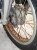 duc__rusted_front_wheel_close_up